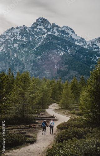 people walking down a hiking trail