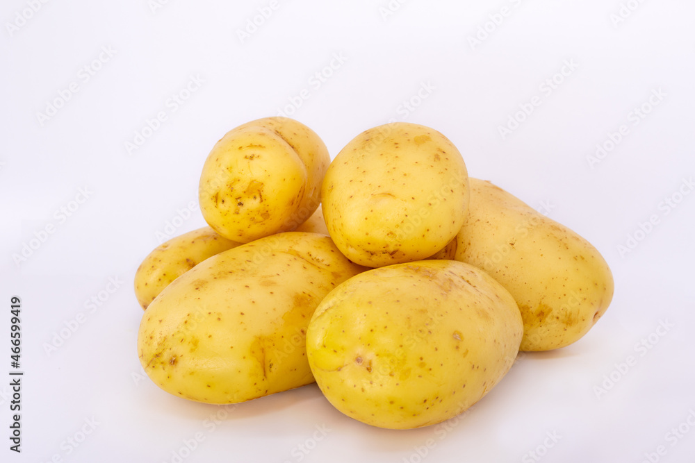 A handful of potatoes on a white background. A handful of potatoes on a white background.