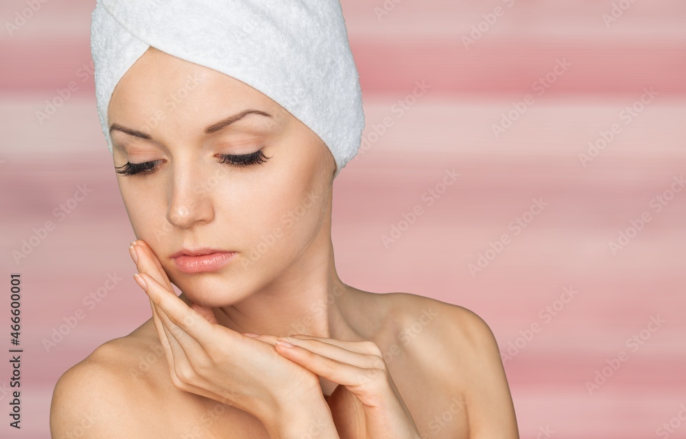 Young woman has a lovely face is feeling happy with her perfect skin touch her face. Young woman has a lovely face is feeling happy with her perfect skin touch her face.