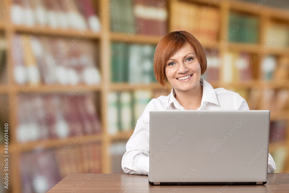 Young girl college student using laptop computer writing Young girl college student using laptop computer writing