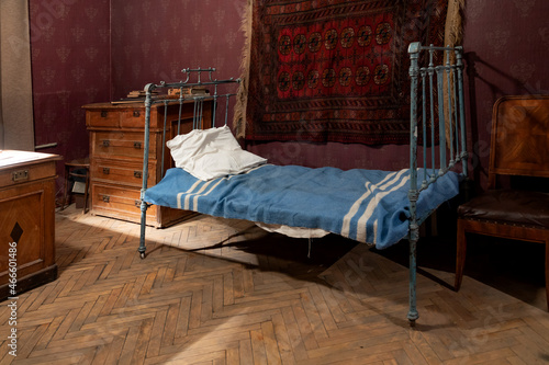 Old vintage metal bed in the interior. 