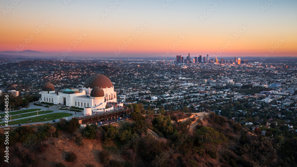 Aerial view of Griffith Observatory and Los Angeles city skyline at sunset