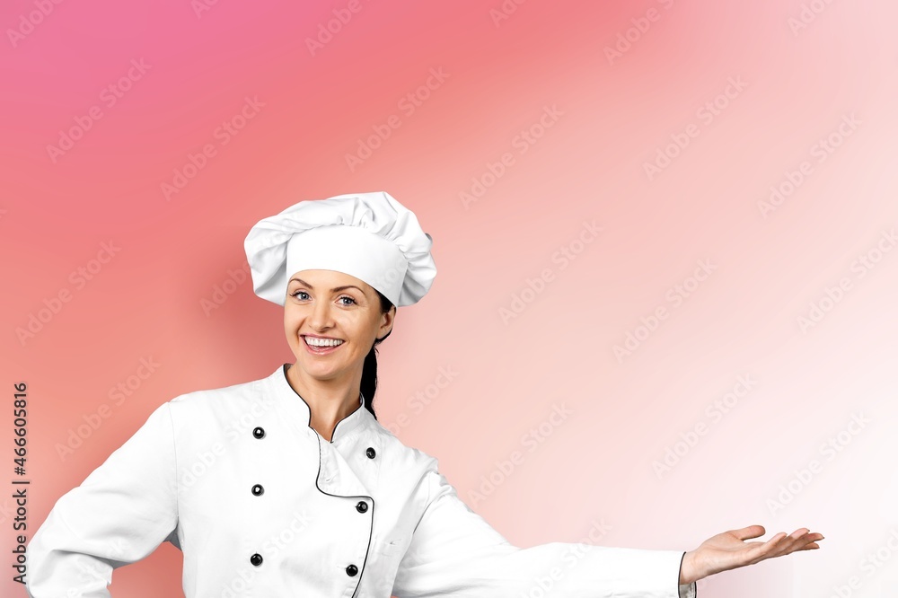 Cute young woman cook posing in white uniform Cute young woman cook posing in white uniform
