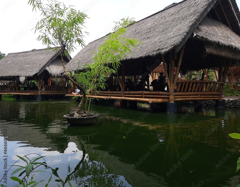 Traditional Asian wooden house on the lake. The floating village on the water Traditional Asian wooden house on the lake. The floating village on the water