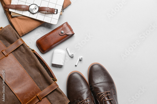 Set of stylish male accessories and clothes on grey background