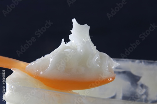 white petroleum jelly or soft paraffin in spoon with jar    photo