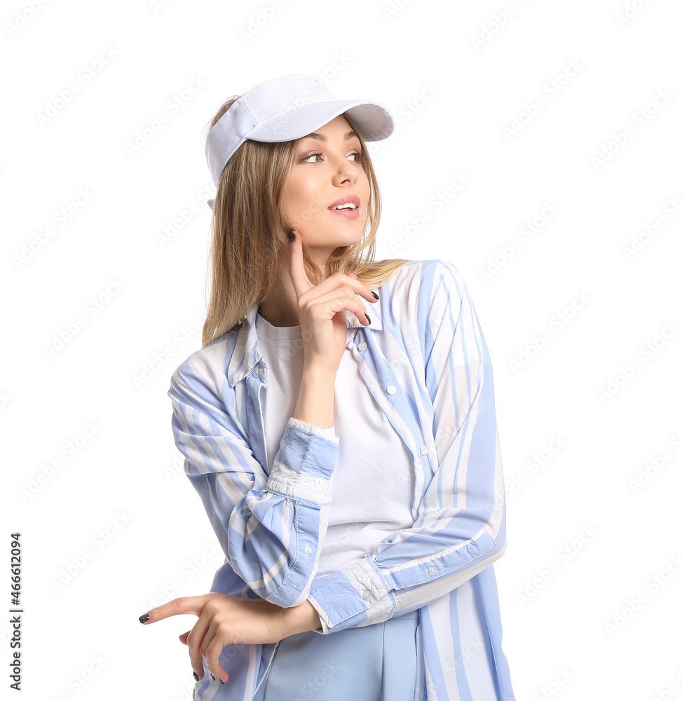 Young beautiful woman with index finger near face wearing visor hat on white background Young beautiful woman with index finger near face wearing visor hat on white background