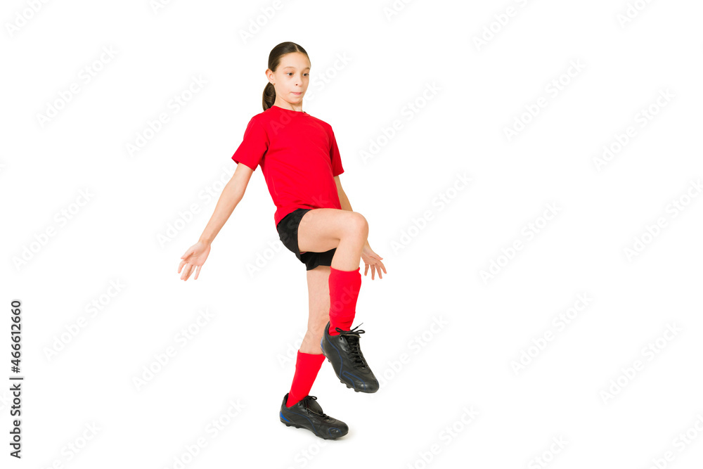 Young girl controlling a soccer ball