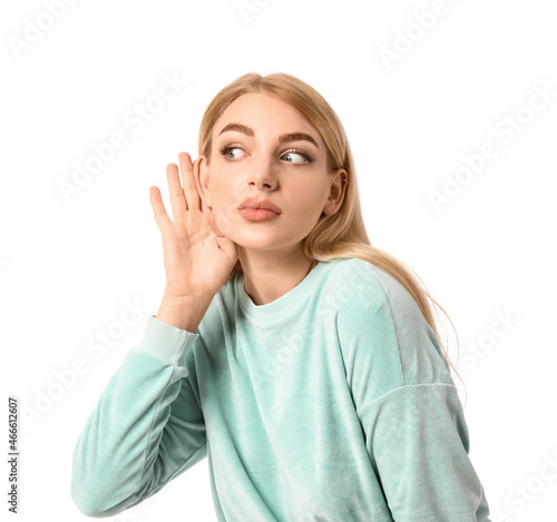 Young woman trying to hear ...