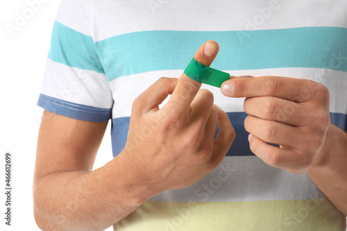 Young man applying green ad...