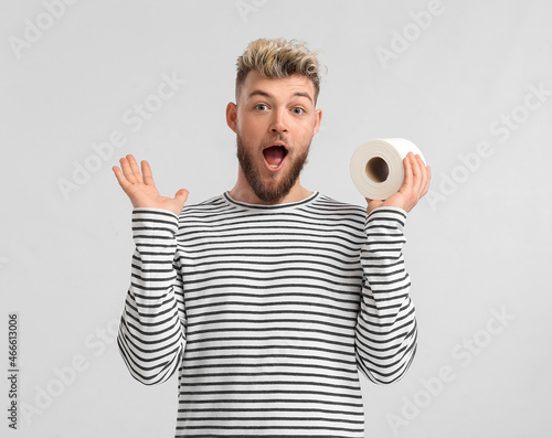 Surprised young man with to...