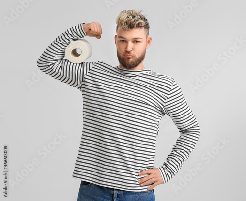 Muscled young man with toil...