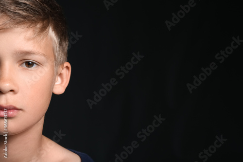 Portrait of little boy on b...