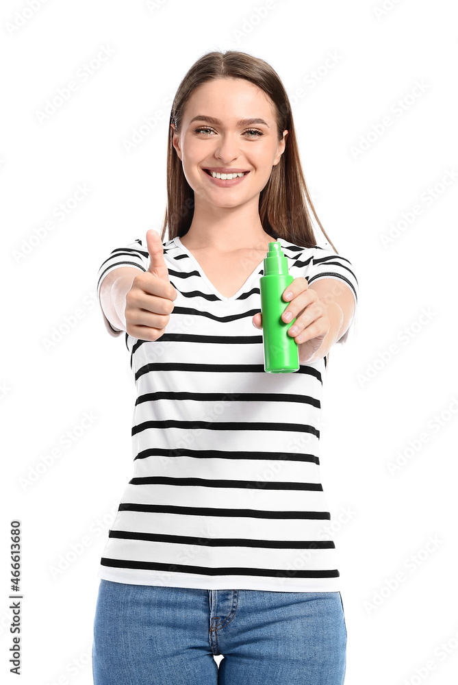 Young woman with mosquito repellent showing thumb-up on white background Young woman with mosquito repellent showing thumb-up on white background