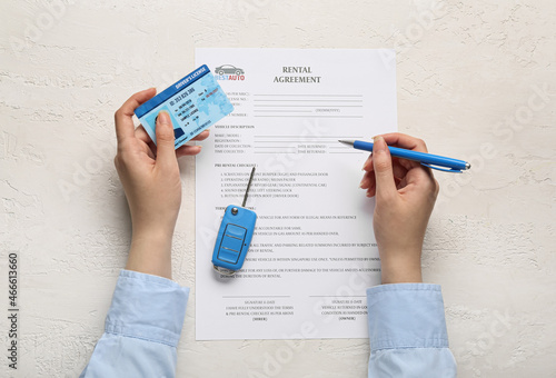 Woman filling in rental agr...