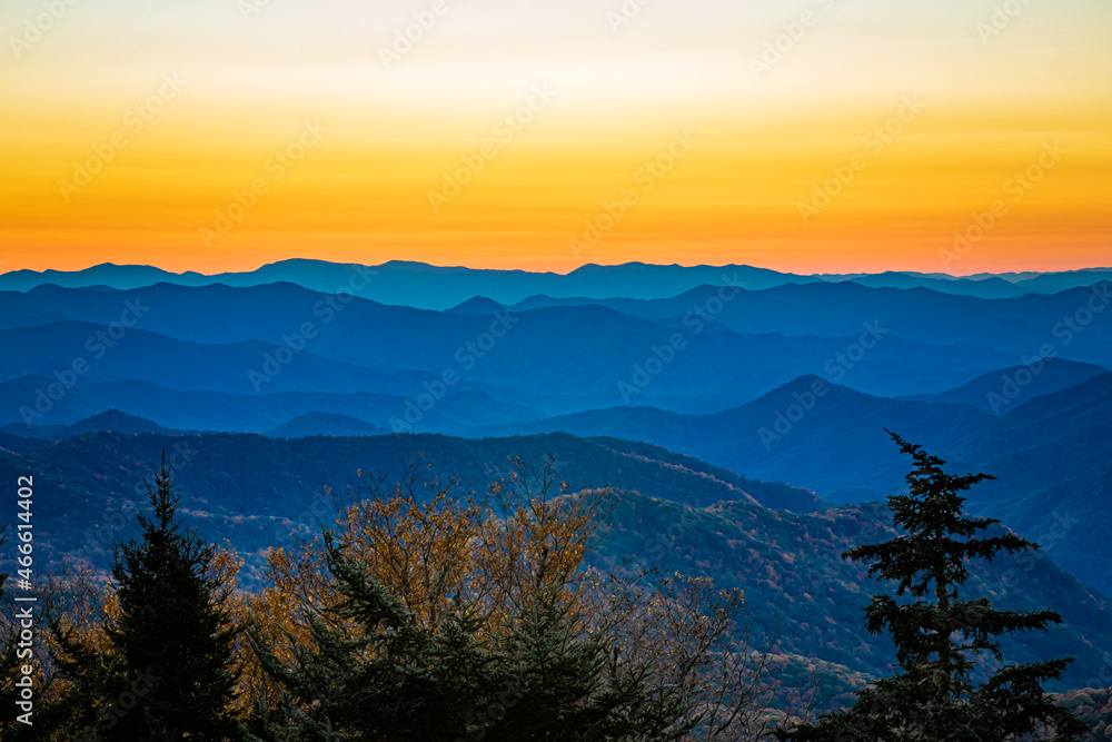 Beautiful landscape of a colorful sky and the Blue Ridge Mountains at sunset in autumn