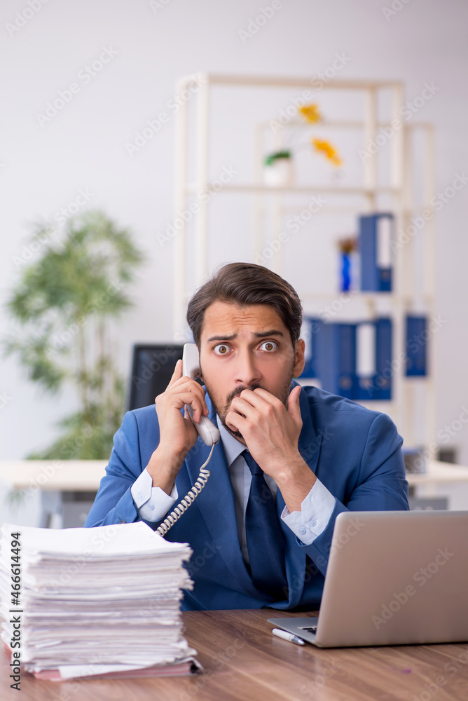 Young businessman employee working in the office Young businessman employee working in the office