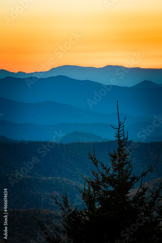 Colorful sky of a setting sun above the ridges of the Blue Ridge mountains in fall