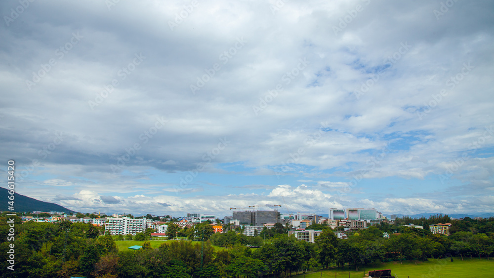 Construction site with yellow lifting crane and blue sky background.