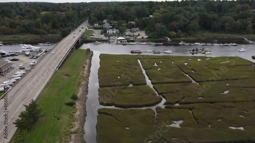 Aerial time lapse of vehicles over bridge on Route 3A over North River in seacoast town of Scituate. photo