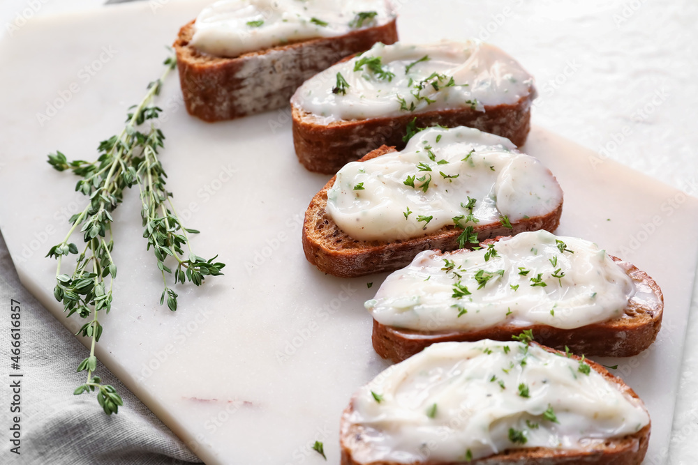 Pieces of fresh bread with lard spread on white background Pieces of fresh bread with lard spread on white background