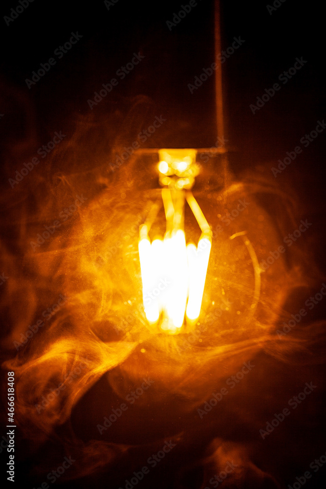 filament lamp on the table in smoke filament lamp on the table in smoke