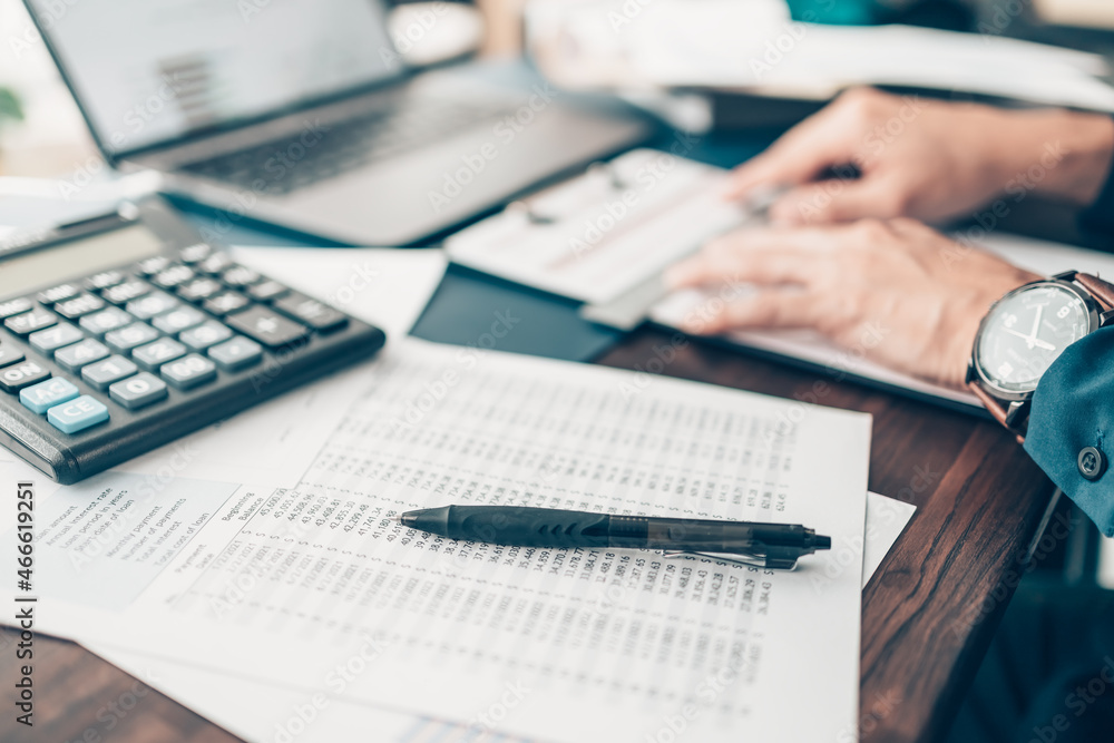 Businessman working on office desk and analyzing new project of accounting finance. Investment, Financial advisor and accounting concept. Businessman working on office desk and analyzing new project of accounting finance. Investment, Financial advisor and accounting concept.