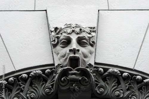 Mascaron with open mouth on old building facade in Kyiv Ukraine