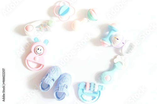 A lots of colorful rattle toys on white background.childhood, beginning childhood and Childcare concept.