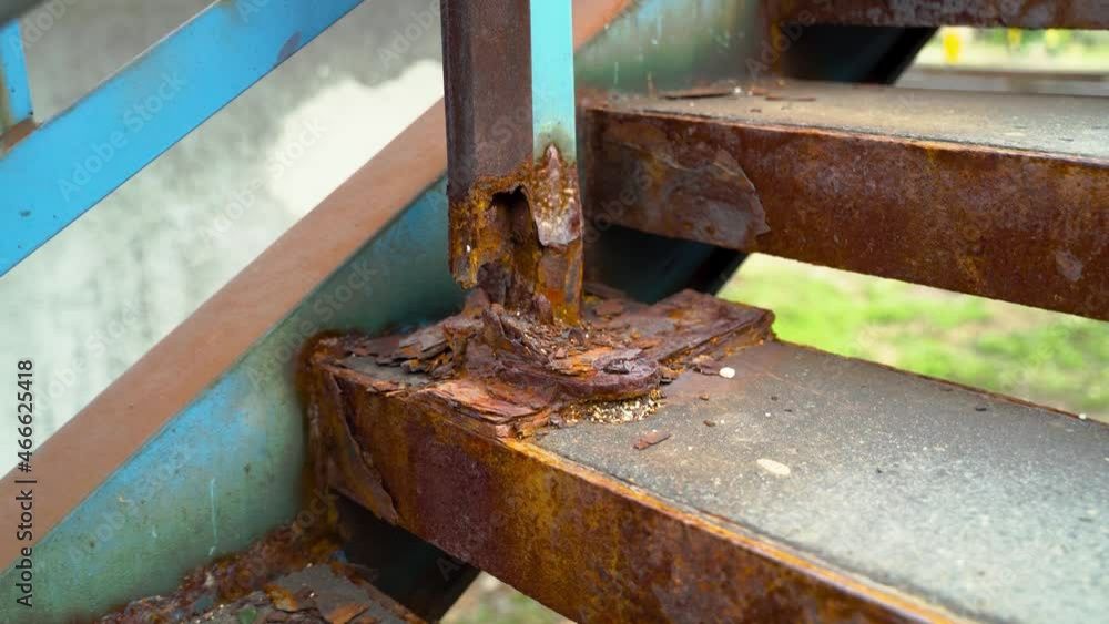 Extremely rusty stairs in Eastern Europe, close-up Extremely rusty stairs in Eastern Europe, close-up