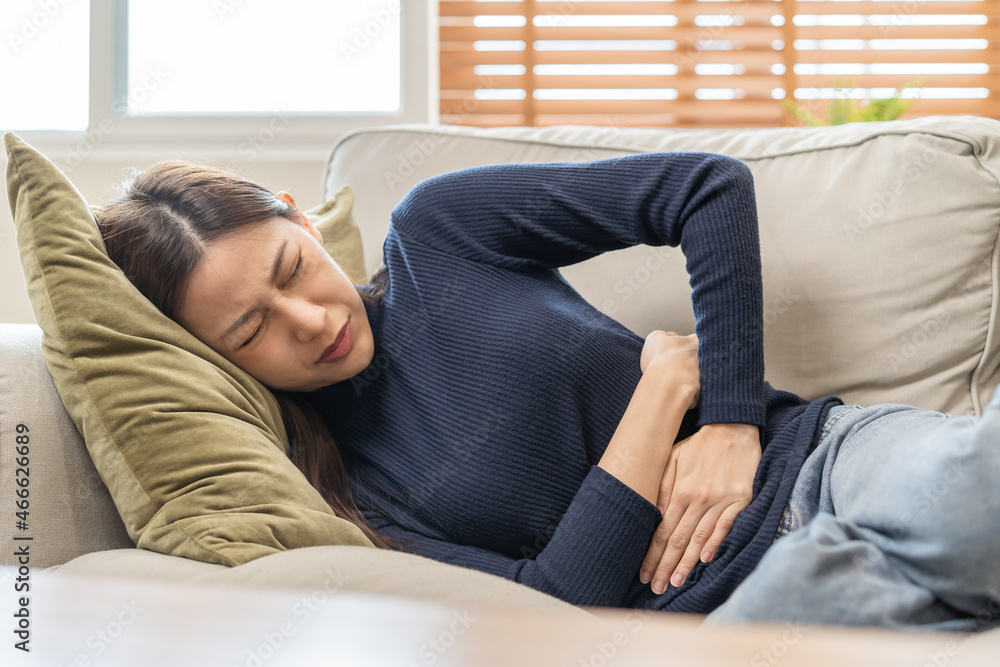Φωτογραφία Flatulence asian young woman, girl hand in stomach ache, suffer from food poisoning, abdominal pain and colon problem, gastritis or diarrhoea