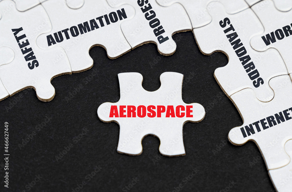On a black background, puzzles with inscriptions, on a separate puzzle there is an inscription - Aerospace On a black background, puzzles with inscriptions, on a separate puzzle there is an inscription - Aerospace