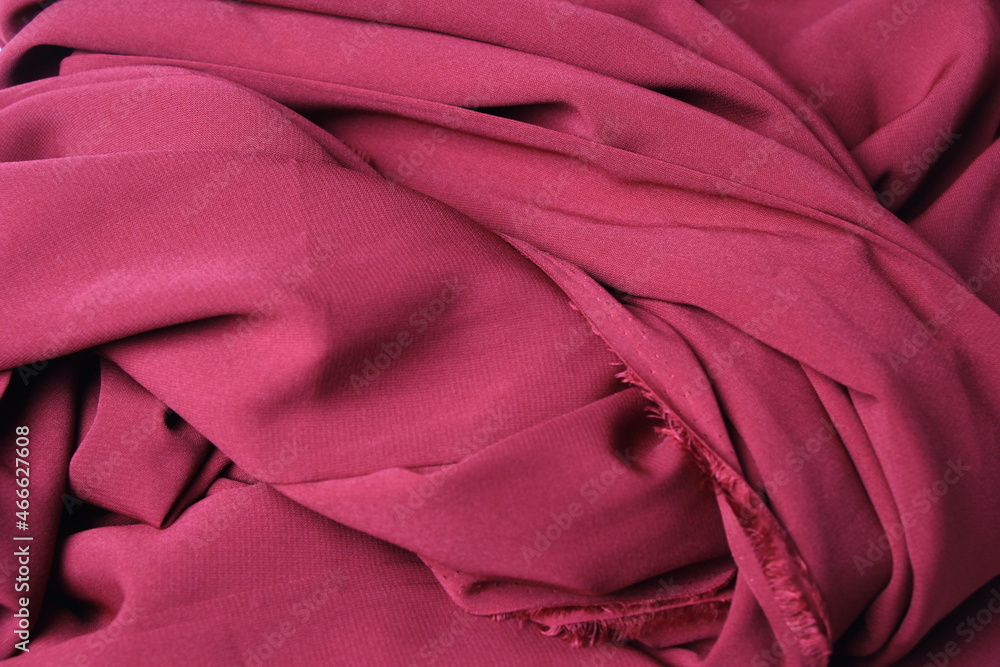 The texture of silk fabric burgundy color. Background, pattern. Luxury chiffon textile pattern. Luxurious valentines day background design The texture of silk fabric burgundy color. Background, pattern. Luxury chiffon textile pattern. Luxurious valentines day background design