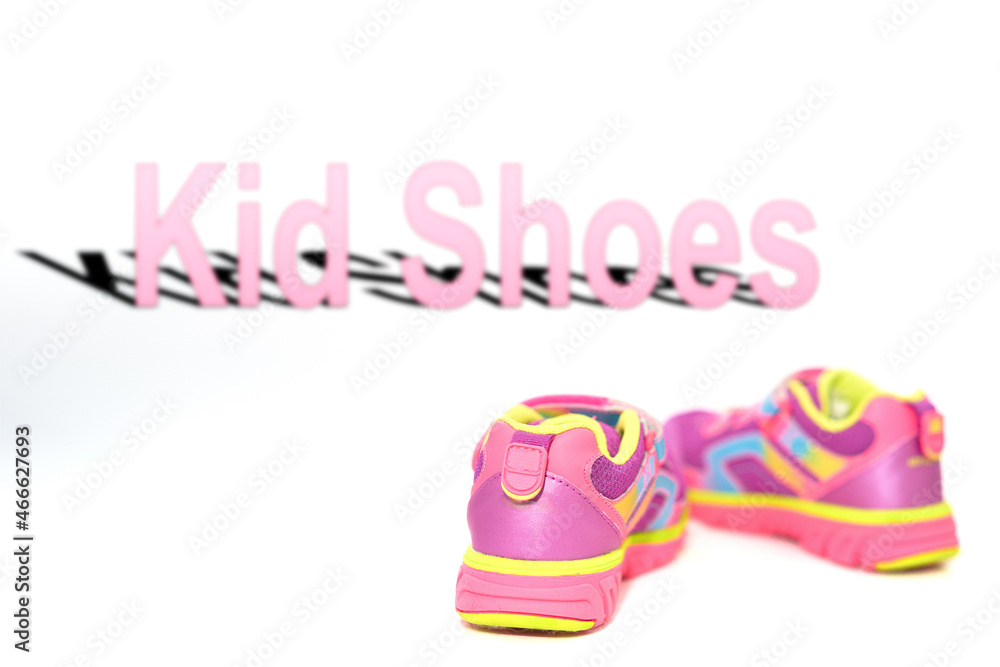 color kid  sneakers shoes on floor back view soft focus on blur kid shoes word