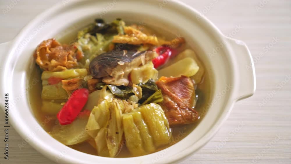 boiled pickled cabbage and bitter gourd soup - Asian and vegan and vegetarian food style boiled pickled cabbage and bitter gourd soup - Asian and vegan and vegetarian food style