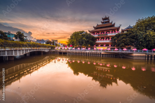 Twilight view of Phap Hoa Pagoda, Ho Chi Minh city, Vietnam. The ancient temple in Southeast Asia. on the vesak festival 2021. © CravenA