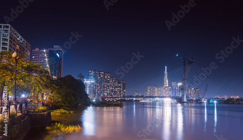 skyline with landmark 81 skyscraper  a new cable-stayed bridge is building connecting Thu Thiem peninsula and District 1 across the Saigon River.