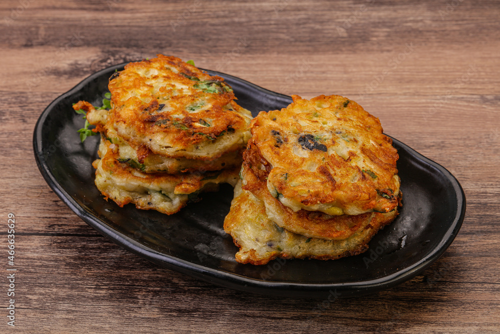 Zucchini pancakes with herbs and spices Zucchini pancakes with herbs and spices