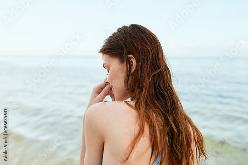 woman in blue swimsuit on the beach island lifestyle