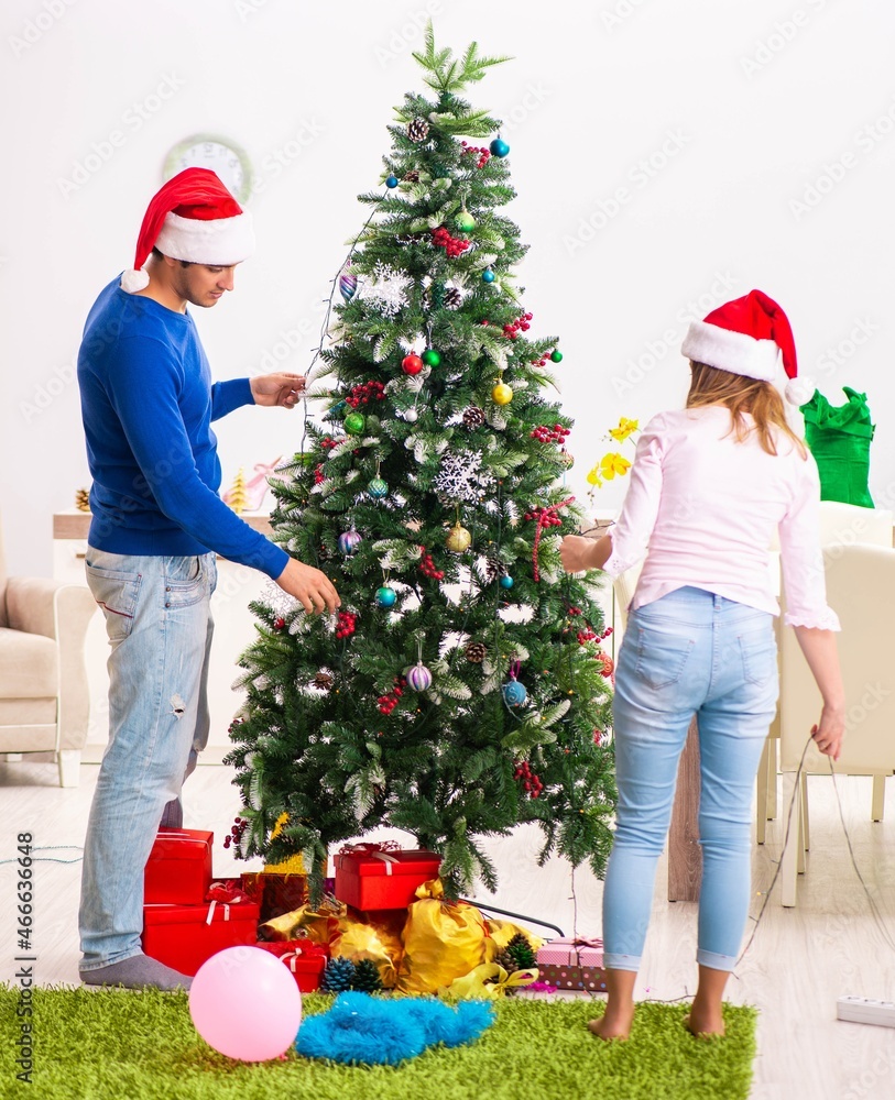 Young family celebrating christmas at home Young family celebrating christmas at home
