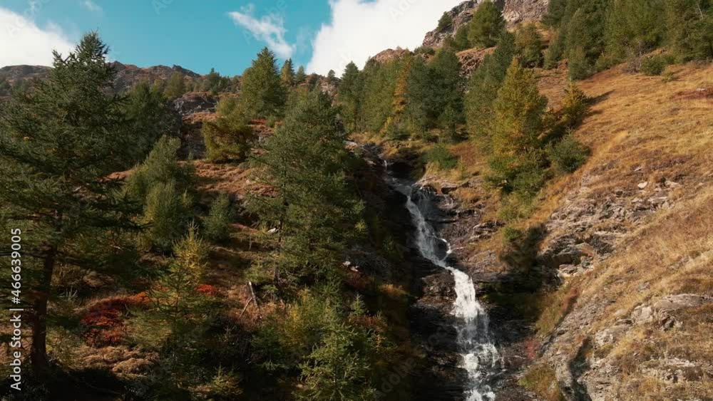 Beautiful white forest waterfall in Piemonte, Italy on a sunny day -Aerial Beautiful white forest waterfall in Piemonte, Italy on a sunny day -Aerial