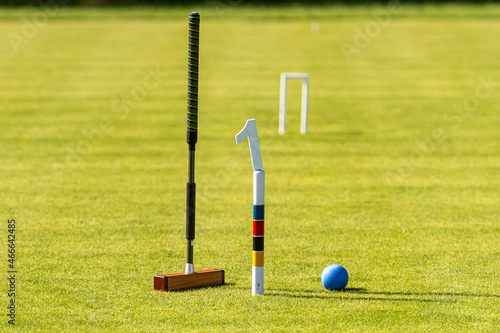 Photography croquet mallet and ball on a lawn