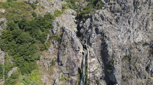 Aerial top-down view of big natural waterfall named 