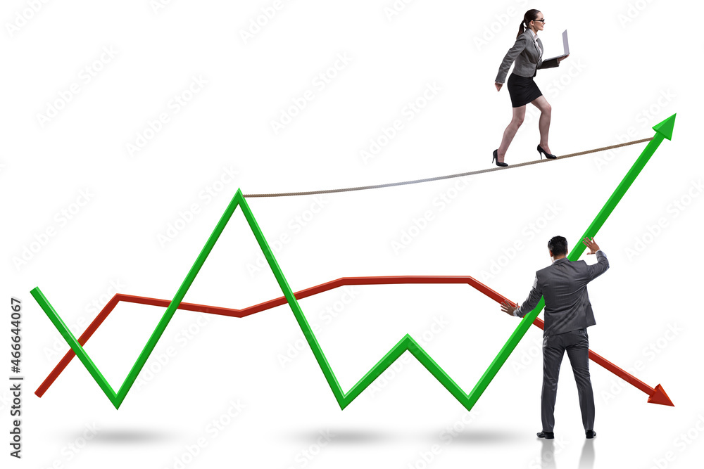 Businessman balancing on tightrope on line chart Businessman balancing on tightrope on line chart