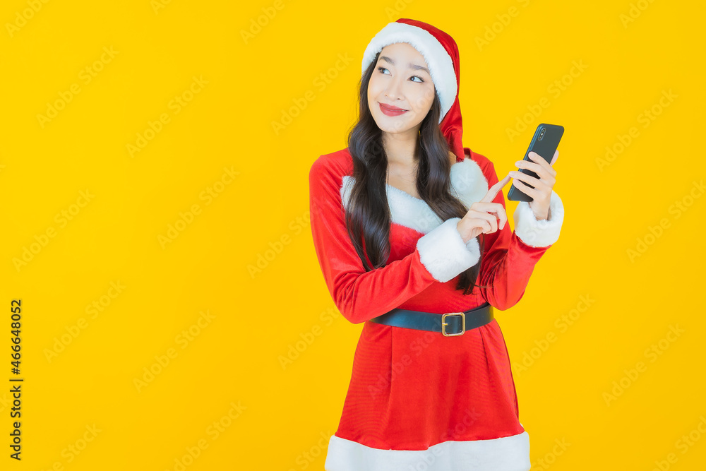 Portrait young asian woman wear christmas costume with action on yellow background Portrait young asian woman wear christmas costume with action on yellow background