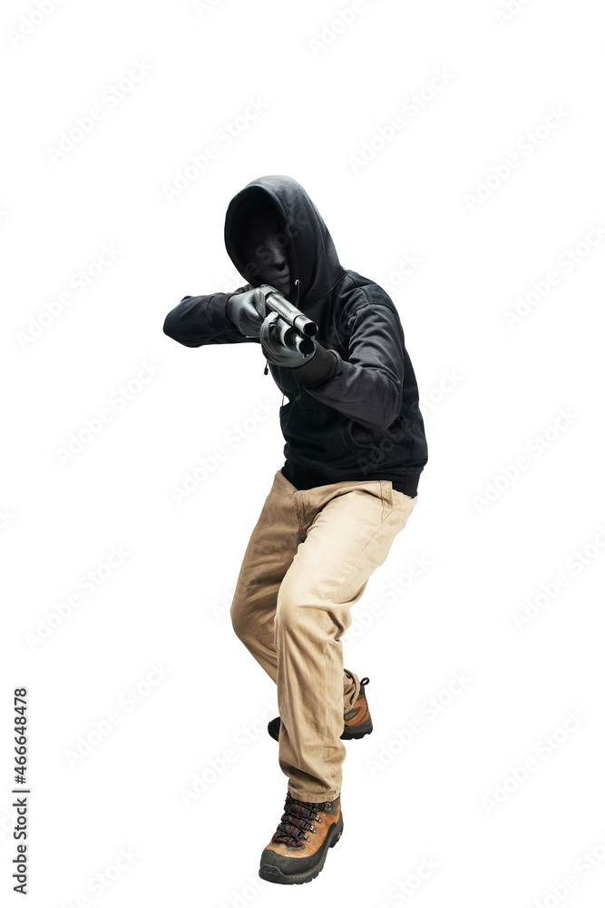 Criminal man in hidden mask pointing the shotgun Criminal man in hidden mask pointing the shotgun