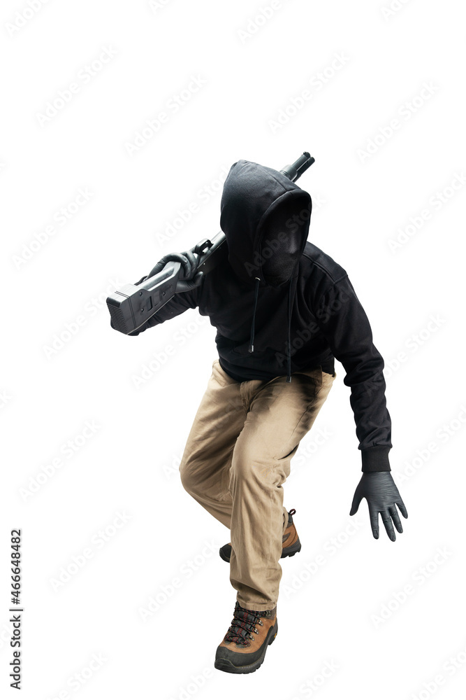 Criminal man in a hidden mask holding the shotgun