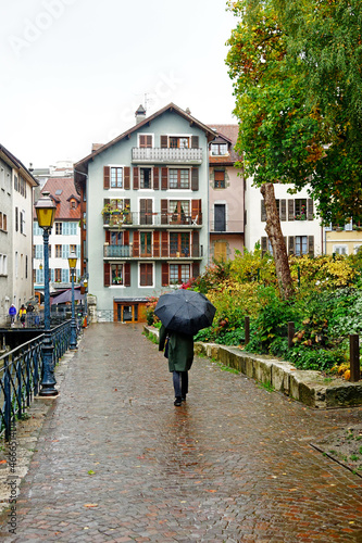 Rainy day in Annecy-le-Vieux, beautiful colorful buildings, old street lamp and colors of autumn