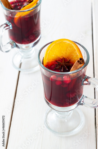 Mulled wine with cinnamon, cranberry and orange. Hot drink. Winter. photo