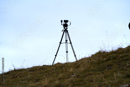 Tripod of photographier at Axalp Bernese Highlands on a grey cloudy day. Photo taken October 19th, 2021, Brienz, Switzerland.